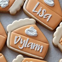 decorated cookies with icing that say lisa and glylam