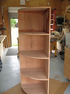 a wooden shelf in the middle of a garage