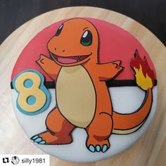 the birthday cake is decorated with an image of a cartoon character and number 8 on it