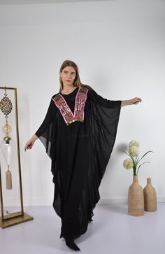 "This kaftan with the vintage embroidery v-neck and transparent chiffon fabric is great to wear over some jeans and t-shirt to look extremely flashy and bohemian. Fabric : 100% chiffon Size : Free sized dress. This Kaftan is a free sized dress meaning that it comes in one size only that fits any size from a small up to a 4XL US (Size 30) . It is designed to take the shape of and drape beautifully on any body type. Kaftan Measurements : Bust and hips - 74 inches Length : 57 inches For reference, Summer Party Kaftan With Floral Embroidery, Party Floor-length Kaftan With Floral Embroidery, Summer Party Embroidered Kaftan, Embroidered Summer Party Kaftan, Embellished Tunic Kaftan For Festival, Bohemian Embellished Tunic Kaftan, Traditional Kaftan With Kimono Sleeves For Party, Festival Embellished Tunic Kaftan, Traditional Embellished Kaftan With Kimono Sleeves