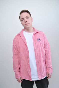 Elevate your casual wardrobe with this 90s pink plaid shirt from TARASCOMMON.ETSY.COM! This vintage check men button-up is a stylish and versatile addition to your collection, perfect for adding a pop of color to your outfit. Crafted from cotton, this 1990s vintage long sleeve shirt offers a comfortable fit that's perfect for everyday wear. The pink plaid pattern adds a fun and playful touch, while the button-up design adds a classic element. Please note that this item is vintage, so it may have Casual Gingham Cotton Flannel Shirt, Preppy Plaid Cotton Top, Casual Pink Long Sleeve Flannel Shirt, Pink Long Sleeve Casual Flannel Shirt, Casual Pink Button-up Flannel Shirt, Plaid Cotton Preppy Shirt, Preppy Plaid Cotton Shirt, Casual Gingham Flannel Long Sleeve Shirt, Casual Long Sleeve Gingham Flannel Shirt