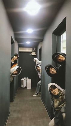 a group of people hanging upside down in a hallway