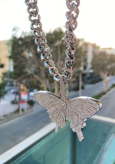 This unapologetic statement necklace has a glamorous catchy look! A big butterfly charm adorns this necklace at its center. A silver chain filled with crystals extends this necklace to 18”. Definitely a conversation starter and a necklace that will add an alluring outlook to your outfits! . Measures 18” . Engraved with Crystals . Butterfly measures 3” x 2” Big Butterfly, A Necklace, Butterfly Charm, Butterfly Necklace, Silver Chain, Diamond Necklace, Statement Necklace, Chain, Crystals