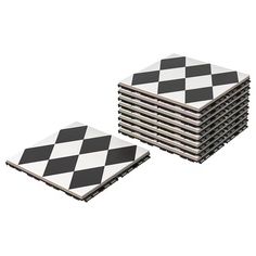 a stack of black and white checkered coasters