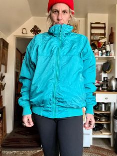 Amazing vintage Nordstroms jacket  Vibrant teal colored with purple fleece lining  Puffy jacket style  Super warm and perfect for cooler temps  Zips all the way up  No hood  But collar goes up neckline if you want it to  Front pockets bottom of jacket  Mountain Mania by Nordstroms  Cotton polyester and nylon materials  Tag reads size large  Measurements are approximate and taken flat so please double bust and waist for more accurate sizing  I do not accept returns  Bust: 24 in  Waist: 22.5 in  L Green Nylon Windbreaker With Fleece Lining, Green Fleece-lined Windbreaker For Cold Weather, 90s Style Winter Hiking Windbreaker, 90s Winter Hiking Windbreaker, Sporty Green Windbreaker For Cold Weather, Vintage Green Outerwear For Hiking, Vintage Winter Windbreaker, Vintage Green Track Jacket For Winter, Puffy Jacket Style