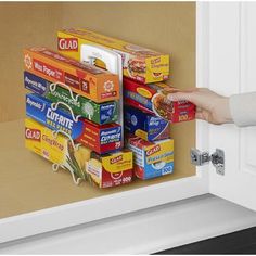 someone is opening the door to get organized for all those boxes of foil, wax paper, and plastic wrap that are always jamming up your drawers