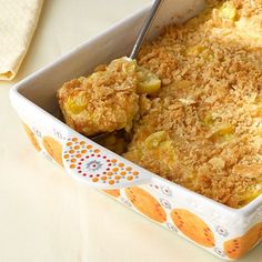 a casserole dish with fruit and crumbs in it on a table