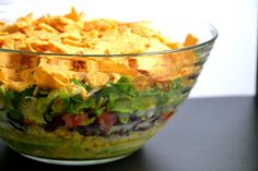 a large salad with tortilla chips in it