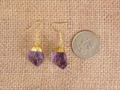 Amethyst crystal point earrings with 24k gold electroplated cap gold plated earwires S12B6-01 Beautiful Natural Amethyst crystals STOCK PHOTOS. Gemstones measure approximately 18mm x 12mm -- each pair will vary slightly because these are natural stones. Earrings measure approx. 40mm in their entirety. Comes in a gift box Gold Amethyst Drop Earrings, Gold Amethyst Crystal Earrings With Gemstone, Gold Amethyst Gemstone Crystal Earrings, Gold Amethyst Crystal Earrings, Gold Amethyst Earrings With Ear Wire, Stones Earrings, Gemstone Earrings Gold, Amethyst Crystals, Crystal Points