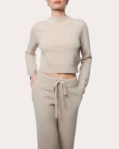 A reflection of nonchalant luxury, the Zoe pullover is knit from eco-friendly Italian cashmere in a neutral beige hue. The cropped silhouette is detailed with ribbed trim, French shoulders and slit sleeve cuffs for elevated appeal. Pull-on French shoulders Slit cuff details Cropped hemline Rib knit trim 100% Italian eco cashmere Hand wash, dry flat Made in Romania Size & Fit Garment measurements: 18in long from high point of shoulder to hem Model (wearing size 1): 5ft 8in tall True to size with Raglan Sweater, Made In Romania, Animal Fur, Sailor Collar, High Hips, Cuff Detail, Neutral Beige, Sweaters Knitwear, High Point