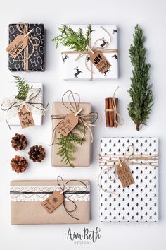 presents wrapped in brown and white paper tied with twine, pine cones, fir branches, and tags