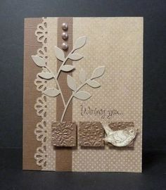 a close up of a greeting card with a flower and bird on the front side