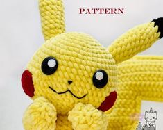 a knitted pikachu doll is posed in front of the french flag and text pattern available