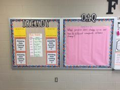 two bulletin boards on the wall in a classroom