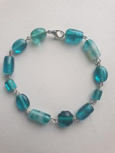 Handmade glass beaded bracelets in shades of blue and white. A deep and rich color. Bracelet fits an 8 inch wrist. Glass Bead Bracelet, Color Bracelet, Handmade Glass Beads, Glass Beaded Bracelets, Bead Bracelet, Glass Bead, Shades Of Blue, Rich Color, Bleu Marine