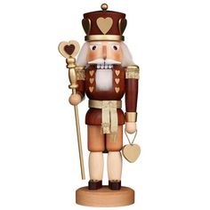 a wooden nutcracker with a heart on it's head and holding a cane