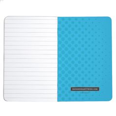 a notebook with blue and white paper on it