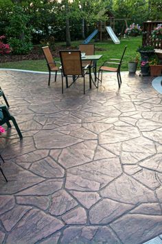 an outdoor patio with chairs and tables