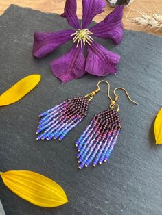 The purple gradient fringe earrings are simply gorgeous! From light lavender to deep amethyst these sparkly and lightweight earrings are the colour of the crown Chakra for deep spiritual understanding. These Boho glass earrings add a lovely pop of colour perfect to awaken your creativity. Small handmade gift for girlfriend, wife, mum, sister. Material: Seed beads handwoven using durable thread. Technique: Brick stitch and fringe Ear wire: You can choose between ear hooks, leverback, stud and clip-on fittings. I offer a choice of finishes including sterling silver 925, gold-plated, golden and silver-colour fittings to suit most needs.   Dimensions: The length stated includes the handmade beaded piece and brass component. For the drop length, add 1.2 - 1.6 cm (ear wire-dependent)  Packaging: Spiritual Understanding, Handmade Gifts For Girlfriend, Beaded Fringe Earrings, Purple Gradient, Mini Earrings, Light Lavender, Earrings Purple, Purple Ombre, Lightweight Earrings