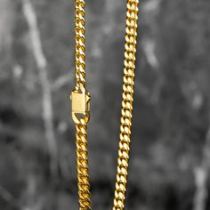 Luxurious Real 18K Gold: Featuring real 18K gold PVD plating on a 6mm 304 Stainless Steel Curb chain, our design boasts flat diamond-cut beveled links for superior shine and a comfortable, strong fit. Tarnish-Resistant Elegance: Crafted to stand the test of time, our Cuban chain features real 18K gold PVD plating on 6mm 304 stainless steel. This advanced plating technique ensures a tarnish-resistant finish, keeping your chain's luxurious shine and appearance intact over time. Hypoallergenic Desi Plating Techniques, Cuban Chain, Bracelet Collection, Curb Chain, High Quality Jewelry, Diamond Cut, Exquisite Design, Luxury Jewelry, Chain Bracelet