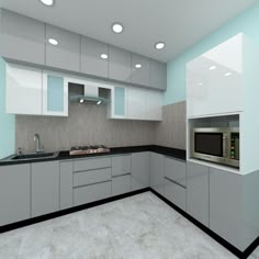 an empty kitchen with white cabinets and black counter tops, is shown in this image