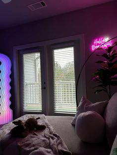 a living room filled with furniture and neon lights