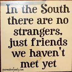 a sign that says in the south there are no strangers just friends we haven't met