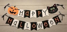 happy halloween banner with black cats and pumpkins