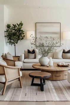 a living room filled with furniture and a painting on the wall above it's coffee table