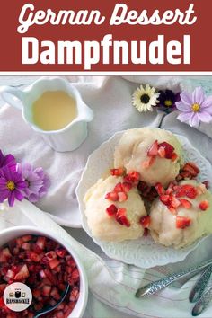 the german dessert dampfuel is served on a white plate with strawberries and flowers