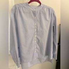 Ann Taylor Size Medium Mandarin Collar, Hi-Low Hem, Long Sleeve Blouse. Light Blue With White Button Down Front. Never Worn, 100% Cotton. L:25&29/ Pit:22/ Sleeves:23.5. Easy Care Blue Button-up Shirt For Layering, Light Blue Cotton Blouse For Daywear, Light Blue Long Sleeve Relaxed Fit Blouse, Light Blue Relaxed Fit Long Sleeve Blouse, Blue Shirt For Spring Layering, Blue Shirt For Layering In Spring, Classic Blue Tops For Layering, Light Blue Relaxed Fit Blouse For Work, Classic Light Blue Tops For Daywear