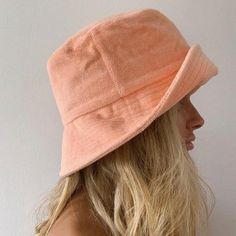 Introducing our cool and simple terry towel bucket hats. Made from 100% terry towelling, the Wave Bucket is soft and durable + perfect for beach days. Throw on this easy to wear style for a sun-safe, street look. Brimmed bucket hat design in pastel Peach Featuring small side pocket ;) 100% cotton terry cloth Spot clean / hand wash This hat is accredited with a UPF Rating 50+ (Australian Tested) Size + Fit: Designed for a relaxed fit, our buckets should be comfortable for wearer and snug in fit ( Bucket Hat Design, Terry Towelling, Lack Of Color, Hat Design, Terry Towel, Street Look, Girl With Hat, Katy Perry