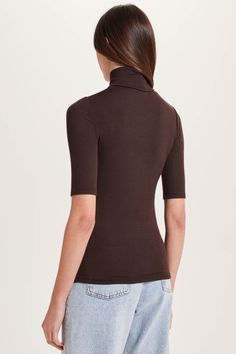 Clever babe: make any outfit look sharp with this luxe micro-rib turtleneck. Half sleeves and a high neck combine with brilliance worth admiring. 96% modal, 4% spandex Luxe micro-rib knit with stretch Made in Peru Body length: 23” Machine wash Ribbed Turtleneck, Outfit Look, Everyday Luxuries, Half Sleeve, Half Sleeves, Best Sellers, Peru, Everyday Essentials Products, Rib Knit