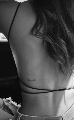 the back of a woman's neck that says, i love you on it