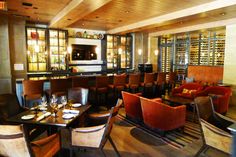 an empty restaurant with many chairs and tables