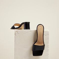 The mid-height Chaise Mules are designed with a flattering asymmetric leather toe strap and a smooth, curved block-heel. Crafted by hand in Italy, they are the epitome of easy elegance and will instantly elevate any look. Fashion Still Life, Dear Frances, Block Heel Mules, Shoes Photography, Black Block Heels, Shoe Inspo, Leather Block Heels, Leather Mules, Day And Night