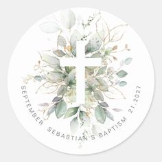 a white sticker with leaves and a cross in the center, on top of it