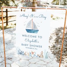 a welcome sign for a baby shower with a sailboat on it