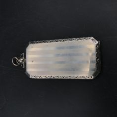 "Very cool old locket that reads \"HELLO\" inside, can possibly hold something? Very cute, never monogrammed. Slight wear. Marked sterling Approx 1&3/8x1\"" Victorian Personalized Silver Locket Necklace, Vintage Rectangular Locket Pendant, Victorian Sterling Silver Locket, Antique Silver Victorian Keepsake Necklace, Silver Victorian Locket Necklace For Memorial, Edwardian Necklace, Geometric Table Lamp, Antique Locket, Cherry Juice