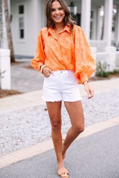 This timeless orange blouse is anything but ordinary. With a unique textured floral print and classic fit, you can truly stand out from the crowd. Long bubble sleeves give it an extra touch of sophistication. Elevate your wardrobe with a blouse that has all the details. This blouse features built in tank lining, long bubble sleeves, a collared neckline, button down front closure, and a textured floral print. Material has no amount of stretch.Sydney is wearing the small. Chic Orange Blouse With Floral Print, Chic Orange Floral Print Blouse, Chic Orange Summer Shirt, Orange Blouse For Fall Day Out, Chic Orange Cotton Blouse, Chic Orange Fall Blouse, Orange Fall Blouse For Day Out, Spring Orange Shirt For Day Out, Orange Long Sleeve Blouse For Day Out