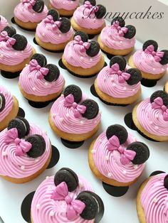 cupcakes with pink frosting and minnie mouse decorations