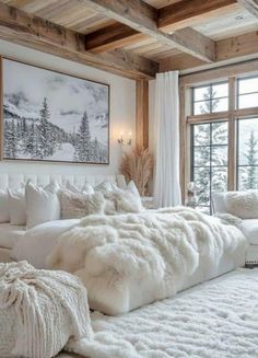 a white bed with fluffy blankets and pillows