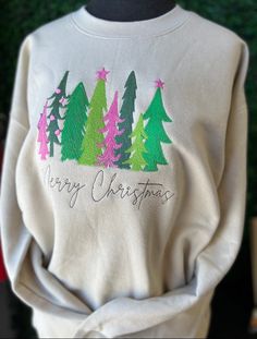 Embroidered Sweatshirt This sweatshirt is a beauty!  This is stitched with beautiful colors that contrast so pretty against the sand colored sweatshirt This is a soft style sweatshirt Get into the holiday spirt! Embroidered Trees, Embroidered Christmas Tree, Colorful Sweatshirt, Ith Embroidery, Christmas T Shirt Design, Womens Sweatshirts, Embroidered Christmas, Cute Shirt Designs, Style Sweatshirt