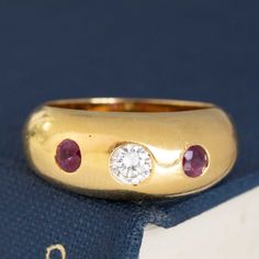 A perfect addition to any Cartier collector's jewelry wardrobe. A bright and sparkly diamond is flanked by a a pair of beautiful and richly hued rubies, all in rich yellow gold. Perfectly proportioned, and a great ring to reach for on the daily.18kt yellow gold, size XX & resizable.Stamped "Cartier" "750"*Qualitative report to follow. Modern Mens Rings, Art Jewelry Earrings, Jewelry Wardrobe, All Band, Ringe Gold, Antique Watches, Antique Engagement, Stacked Jewelry, Vintage Band