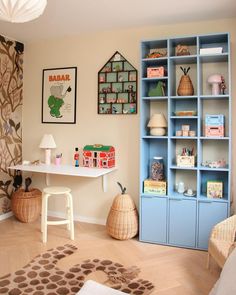 a child's room with toys and bookshelves