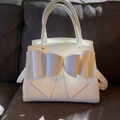 New Without Tags. Romantic, Elegant White Leather Satchel. Gold Tone Accents And Removable Shoulder Strap. Bags Elegant, Garden Tote, Leather Satchel, Kate Spade Top Handle Bag, White Leather, Satchel, Top Handle Bag, Shoulder Strap, Color White