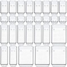 a large group of clear plastic containers with holes on the top and bottom, all lined up in rows