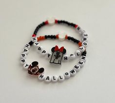 Set of 2 adult size friendship style beaded bracelets with phrase and charms. Perfect for Halloween gifting or trick-or-treating! "Happy Halloween" Bracelets are made to be approximately 6.5-7 inches in length unstretched. For a smaller or bigger size please message me before purchasing and I can make adjustments   ❗️Important:  To keep your bracelets in great condition we recommend: * Avoid contact with water, perfumes, lotions, and other liquids or chemicals. Remove bracelets before engaging i Fun Personalized Black Bracelets, Personalized Fun Black Beaded Bracelets, White Beaded Bracelets For Halloween Gift, Personalized Beaded Bracelets For Halloween, Halloween Gift Bracelets With Letter Beads, Personalized Halloween Beaded Bracelets, Customized Beaded Bracelets For Halloween Gift, Customized Novelty Friendship Bracelets, Novelty Beaded Bracelets For Halloween Gift