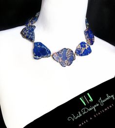 ❤ Get An Instant 20% OFF This Item Plus A FREE GIFT With Purchase When You Join The "Vivid Royals" Club Today! ❤ ❤ https://www.ShopUs.VividDesignsJewelry.com ❤ ❤ Follow Us Here:  ★ Royals.VividDesignsJewelry.com ★ Navy Blue Impression Jasper Statement Necklace- Blue Necklace Gift For Women- Gift For Her- Gift For Mom- Gift For Wife- Gift For Sister- Midnight Blue- Royal Blue Stone Necklace- Nautical Necklace. Blue Statement Necklace! This stunning statement  necklace  is a true eyecatcher. Vibrant Blue Color with Creamy Veining Throughout.  Free Form Stone Statement Necklace. Blue Jasper Stones. Gold or Silver Chain with Lobster Clasp Closure.  This statement piece is adjustable, flexible and Comfortable to wear.   Stones are free form stones and no necklace is exactly alike as all stone s Blue Lapis Lazuli Jewelry, Blue Large Pendant Necklace, Elegant Royal Blue Gemstone Necklace, Luxury Blue Statement Necklace, Luxury Blue Multi-stone Necklaces, Luxury Statement Lapis Lazuli Necklace, Nautical Necklace, Blue Stone Necklace, Blue Statement Necklace