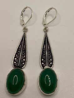 Antique vintage Green Chrysoprase Silver dangle earrings Delicate and detailed hand set vintage green chrysoprase Antique and Silver leverback earrings These dangle earrings are about 2 inch long All jewelry is shipped in a nice gift box. Check out our over a THOUSAND great reviews Can be converted to Clip on earrings add request Vintage Green Cabochon Earrings, Antique Green Drop Earrings, Victorian Green Drop Earrings, Green Cabochon Drop Earrings, Vintage Cabochon Dangle Earrings, Victorian Handmade Green Earrings, Classic Green Earrings With Ear Wire, Victorian Green Dangle Jewelry, Green Cabochon Dangle Earrings